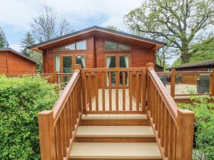a wooden staircase leading to a tiny house at 8 Waterside Wood in Windermere