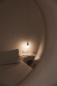 A bed or beds in a room at Aether Boutique Stay