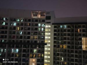 a view of a tall building at night at CQ3311- SELF CHECK-IN- WI-FI- NETFLIX- PARKING-BALCONY - CYBERJAYa , 2018 in Cyberjaya