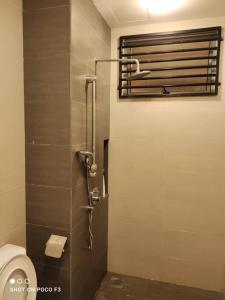 a bathroom with a shower stall with a toilet at CQ3311- SELF CHECK-IN- WI-FI- NETFLIX- PARKING-BALCONY - CYBERJAYa , 2018 in Cyberjaya