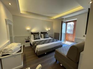 Posteľ alebo postele v izbe v ubytovaní Hotel Isolabella Wellness