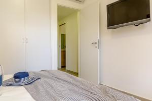 TV a/nebo společenská místnost v ubytování Suite Home Astrid