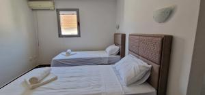 Postel nebo postele na pokoji v ubytování APARTMANI NINI