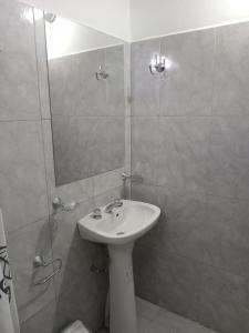 a bathroom with a sink and a shower at El Tonel in Cafayate
