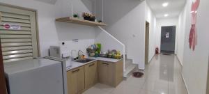 a kitchen with a sink and a counter top at Yes Muar in Muar