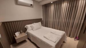 Un pat sau paturi într-o cameră la VILLA DI TONDO HOUSE - APARTAMENTO ESPETACULAR