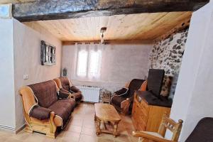 a living room with two couches and a tv at El Descanso del Talegones in Torrevicente +25 photos