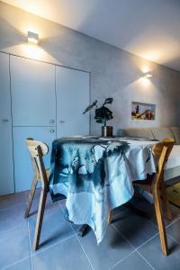 a dining room with a table and two chairs at Casa do Sal in Albufeira