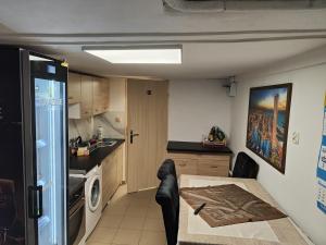 a kitchen with a table and a dining room at Mieszkanie Rampa in Iława