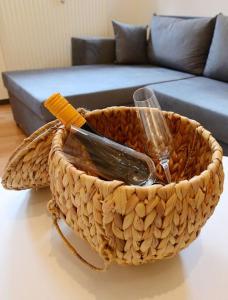a basket of food on a table with a couch at Ferienwohnung Ivanka mit Garten in Schliersee