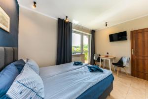 Postel nebo postele na pokoji v ubytování Przystań Nemo