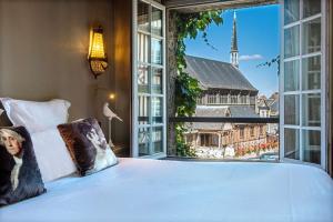 Postel nebo postele na pokoji v ubytování Les Maisons de Léa & Spa - Radisson Individuals