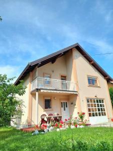 a house with a balcony on the side of it at Holiday Home Mirza in Sarajevo +29 photos