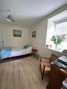 Postel nebo postele na pokoji v ubytování Geraldine House