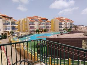a view of the pool from the balcony of a apartment at Cabral Beach Apt with Pool - Sol y Mar in Sal Rei