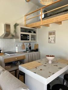 a kitchen with a counter and a counter top in a room at Sueño in Taktikoúpolis