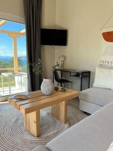 a living room with a coffee table and a couch at Sueño in Taktikoúpolis