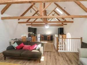 a living room with a couch and a dining room at Chapel House in Okehampton