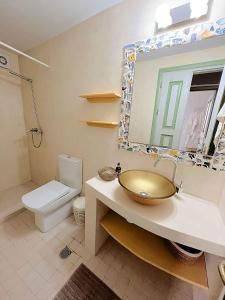 a bathroom with a sink and a toilet at Blue Horizon Kastellorizo in Meyisti