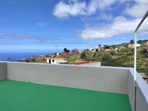 a view of the ocean from the balcony of a house at Casa Nogal in La Matanza de Acentejo