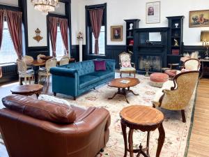 a living room with a couch and chairs at The Oliver Inn in Duluth