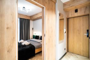 Posteľ alebo postele v izbe v ubytovaní Apartament Niebiańska Polana by Apart Concept Podhale