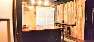 a kitchen with a counter top and a fireplace at Hocking Hills Rusty Lofts in Logan