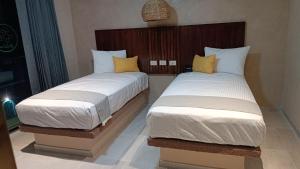 Hotel Yaxactun 객실 침대