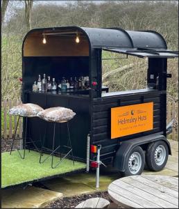 a trailer with a bar in the back of it at Cliff Stud Retreat - Luxury lodges and cosy cottages in Helmsley