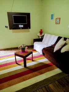 En eller flere senge i et værelse på Casas de temporada Serra dos Bitus