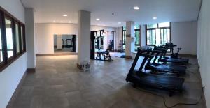a gym with several treadmills in a room at Suíte Condomínio Vista Azul - Pedra Azul in Domingos Martins