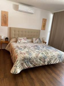 a bedroom with a large bed in a room at Apartamento Los Marinos in Tías +31 photos