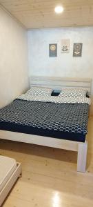 Postel nebo postele na pokoji v ubytování Ramučių sodyba