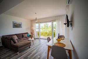 a living room with a couch and a table at Apartments Edera in Tivat