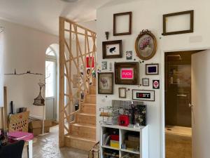 a living room with a staircase and a stair case at Ecole des hautes cotes in Fussey