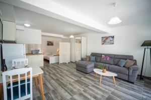 a living room with a couch and a table at Apartments Edera in Tivat