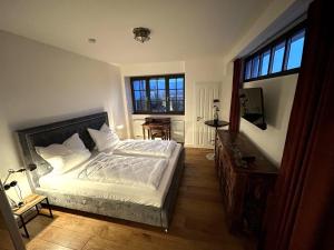 Ένα ή περισσότερα κρεβάτια σε δωμάτιο στο Residenz im Alten Wasserturm