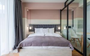Postel nebo postele na pokoji v ubytování Devdaraki Apartments