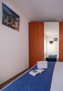 Postel nebo postele na pokoji v ubytování Burano L' Occhio sulla Laguna
