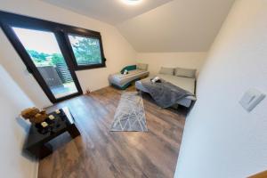 an overhead view of a living room with a couch at Apartman Enjoy in Bihać +60 photos