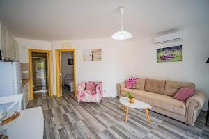 a living room with a couch and a table at Apartments Edera in Tivat