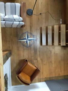 a room with a wooden wall with a toilet at La Maison de l'Aérogrange in Biscarrosse +47 photos