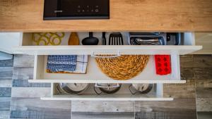 a drawer in a kitchen with a drawer organizer at Apartments Edera in Tivat