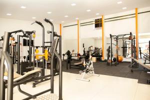 a gym with treadmills and machines in a room at MAPER MARDAN in Parauapebas