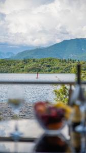 a view of a lake with a red object in the water at Apartments Edera in Tivat