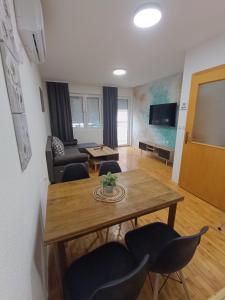 a living room with a table and chairs at Finesi apartments 3 in Ohrid