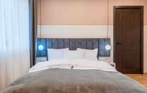 Postel nebo postele na pokoji v ubytování Devdaraki Apartments