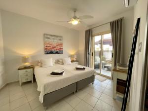 Postel nebo postele na pokoji v ubytování Olive Apartment