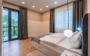 Postel nebo postele na pokoji v ubytování Devdaraki Apartments