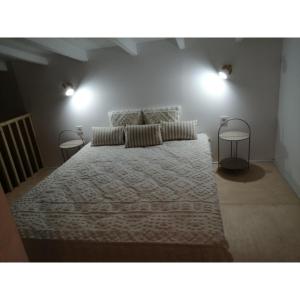 a bedroom with a large bed with two tables at Alos 2 in Ammouliani